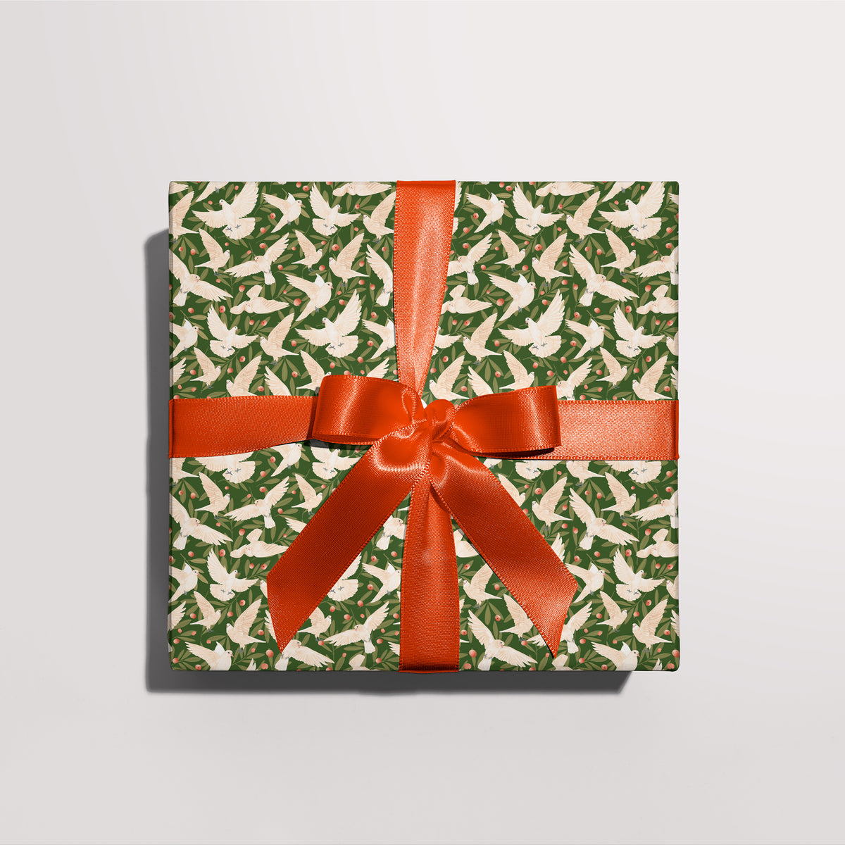 Gift wrapped in Peace Doves gift wrap with a red ribbon